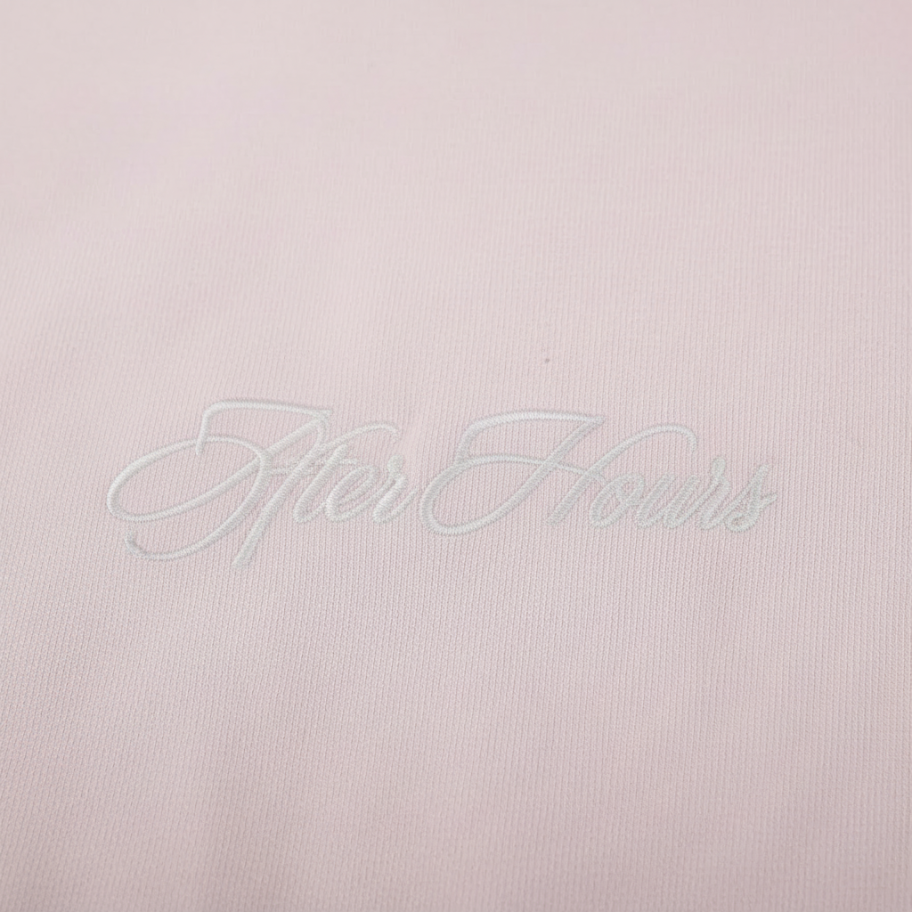close up image of the logo on he back of the hoodie that reads "After Hours" in white embroidered cursive.